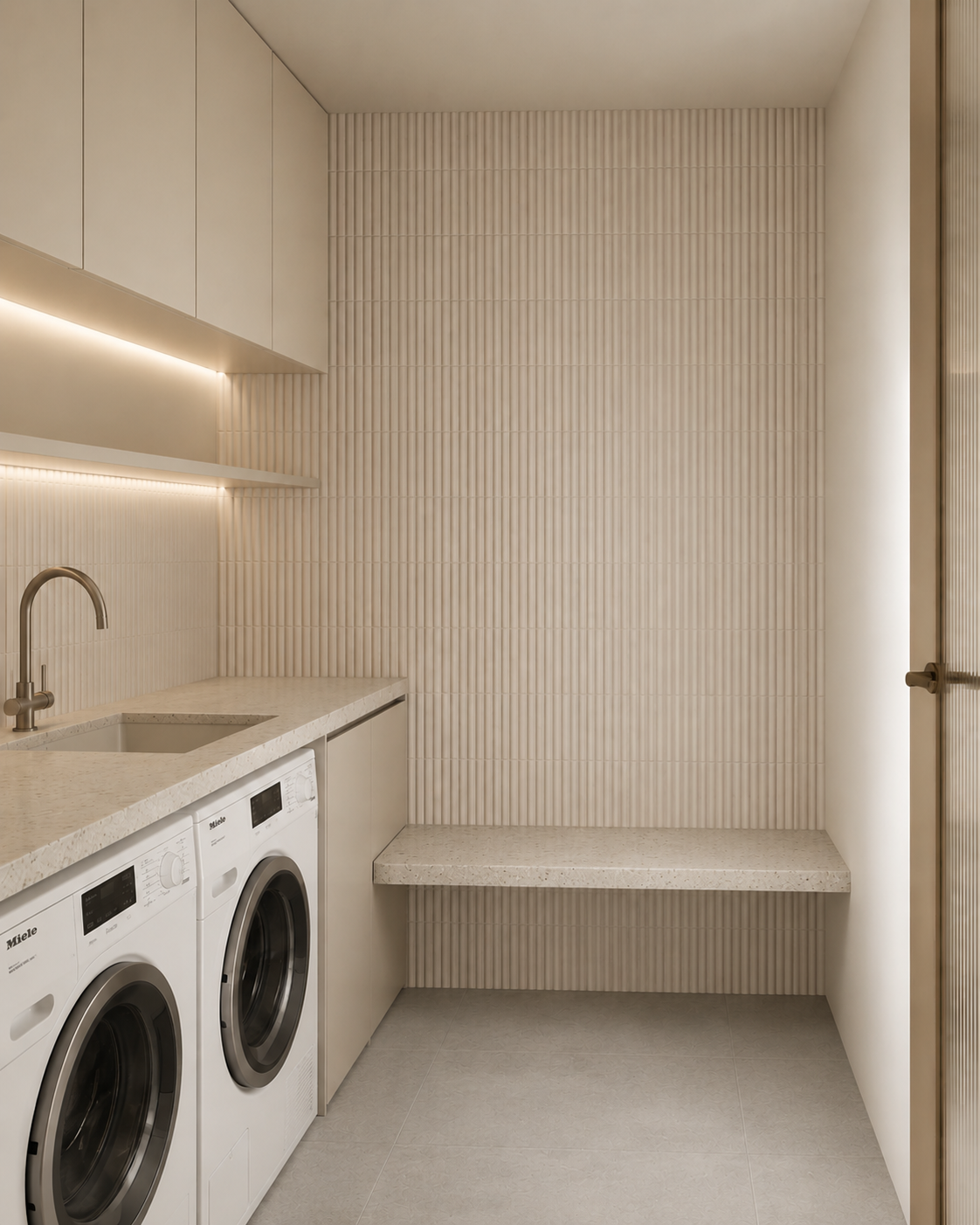 Light neutral laundry cabinetry with bench seating