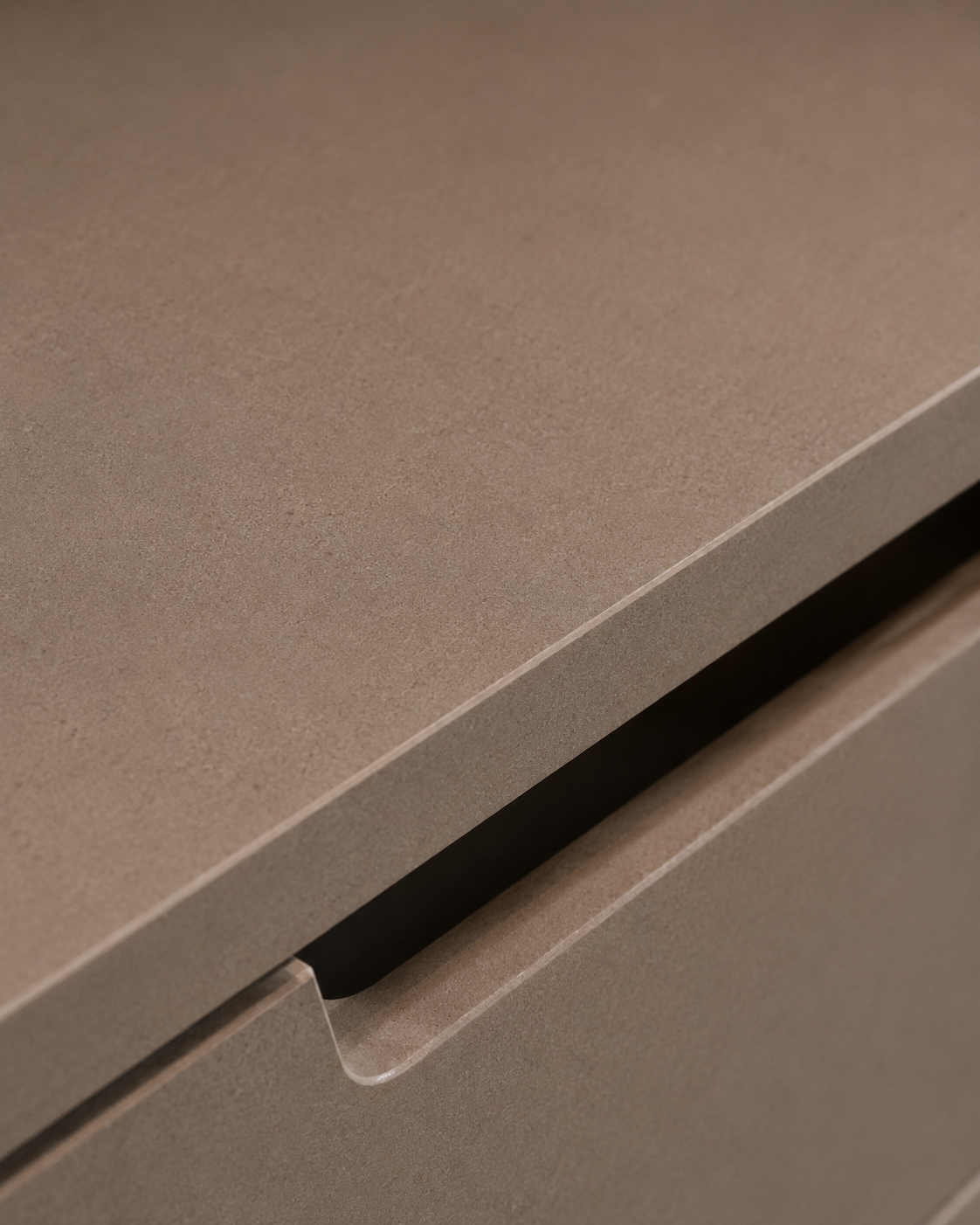 Close-up of the wardrobe drawer handle and textured finish