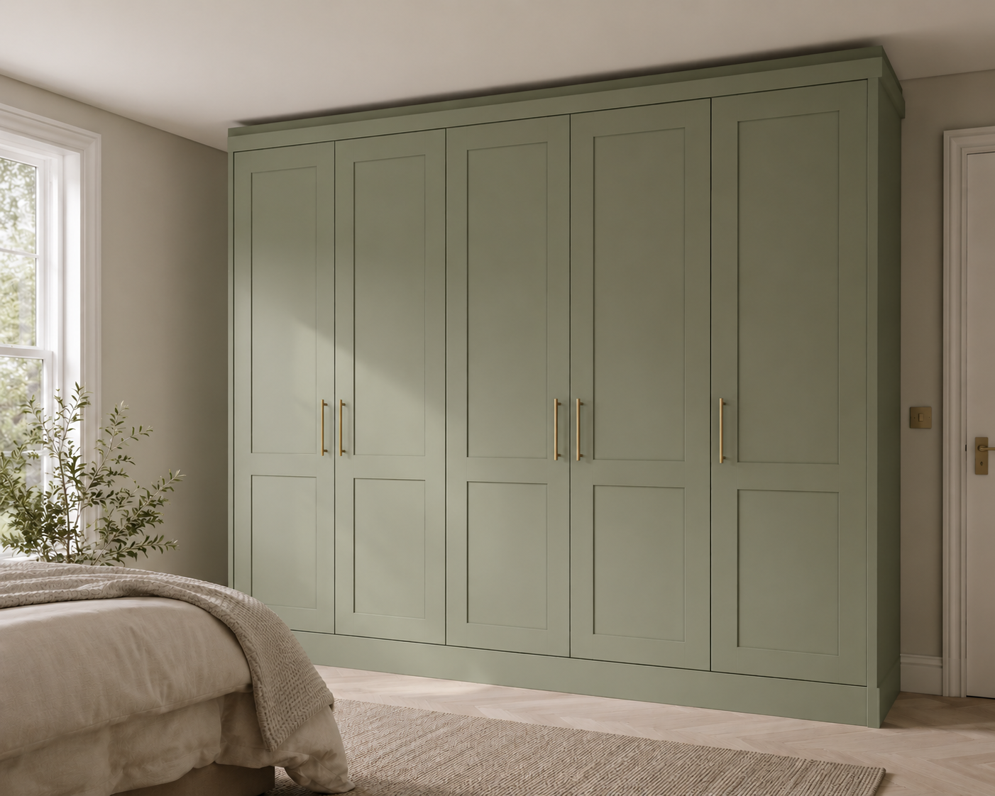 Green built-in wardrobe with brass handles